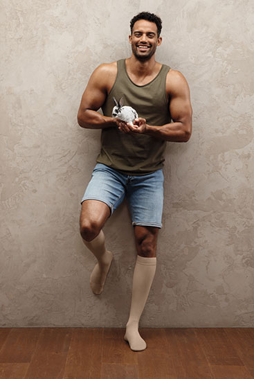 Juzo Intenso Strong man wears Juzo Intenso and has a bunny on his hand
