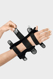 Palmar Xtec Rhizo wrist orthosis is fixed in place with micro touch fasteners