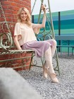 Woman sitting on a swing