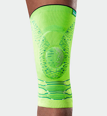Neon-Kniebandage, Glowing Green Bein mit Kniebandage Genu Xtra in der Farbe Glowing Green