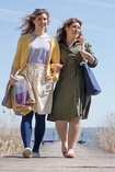 Two women walking on the dock